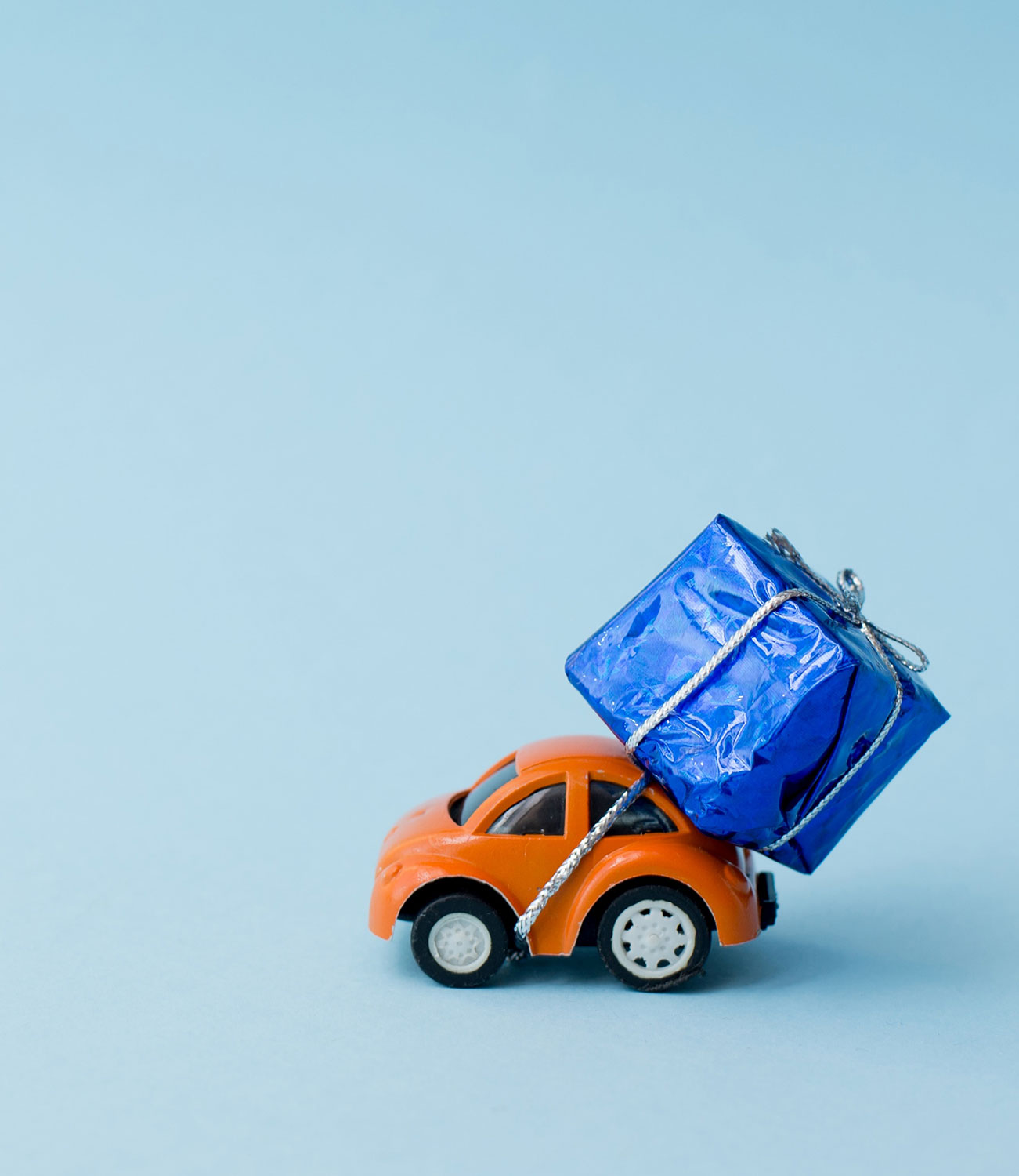 Toy Car Carrying a Blue Gift